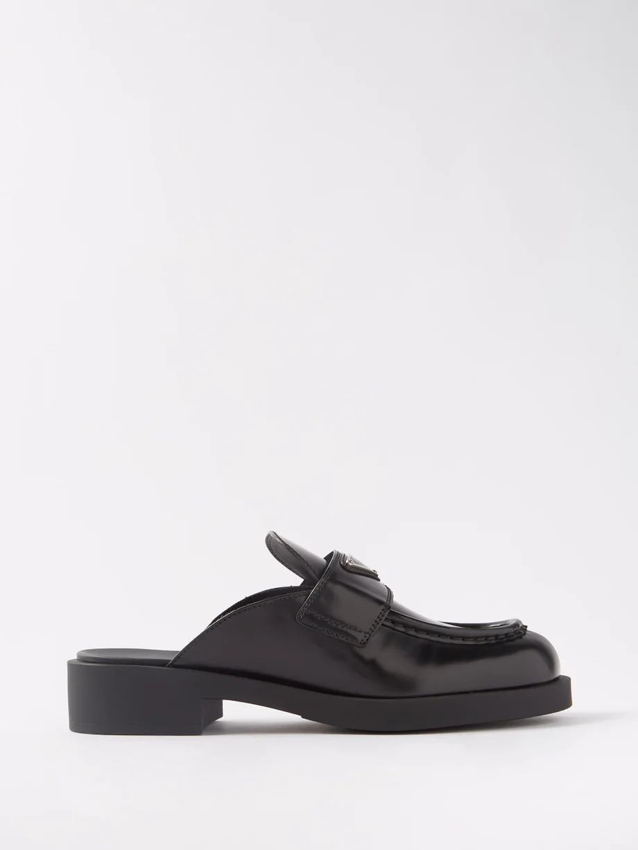 Triangle logo-plaque leather backless loafers | Prada | Matches (UK)