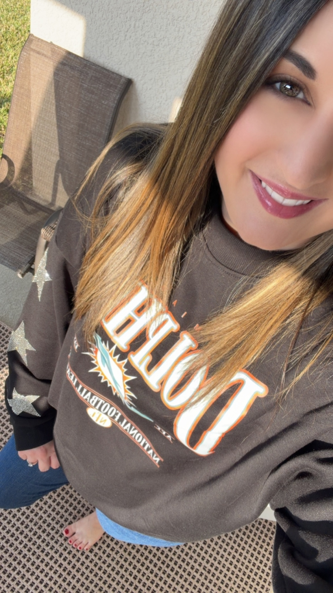 Football Sunday in my new favorite fan gear! 10/10 for this Christmas gift I received. #OOTD

This Women’s Gameday Couture Black Miami Dolphins Pure Victory Rhinestud Star-Sleeve Pullover Sweatshirt is the PERFECT mix of cozy and cute for game day!

The rhinestud star sleeves add a fun, elevated touch while still keeping it comfy for watching from home, heading to a watch party, or running errands before kickoff. 

Easy to style with jeans or leggings and always a win for Miami Dolphins game day outfits. 

Fins up!

#LTKGiftGuide #LTKMidsize #LTKootd