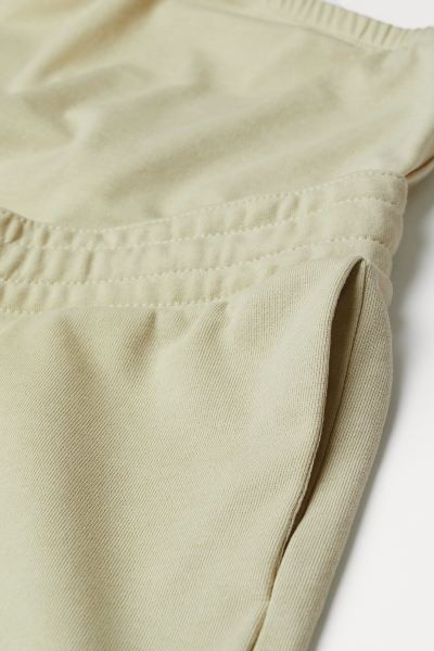 Short sweatshorts in a lightweight cotton blend. Wide panel at waist for best fit over the tummy ... | H&M (US + CA)