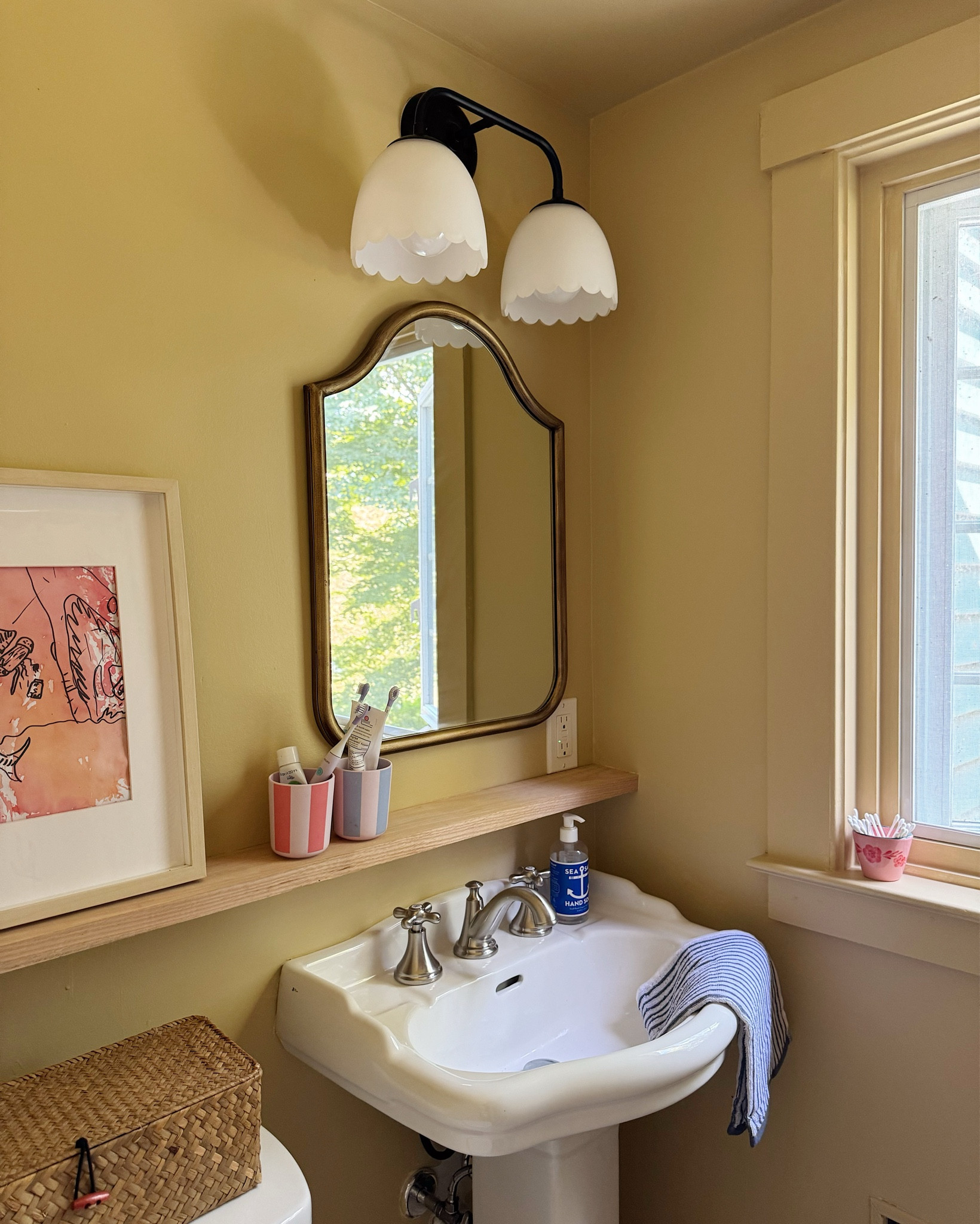 refreshed kids bathroom — painted it yellow to embrace the existing vintage tile but i’m conflicted if it’s too yellow now 😆 what i do know is it’s sooo much cuter than it was! the star of the show is the adorable light from @bedbathandbeyond

#LTKHome #LTKFamily #LTKKids