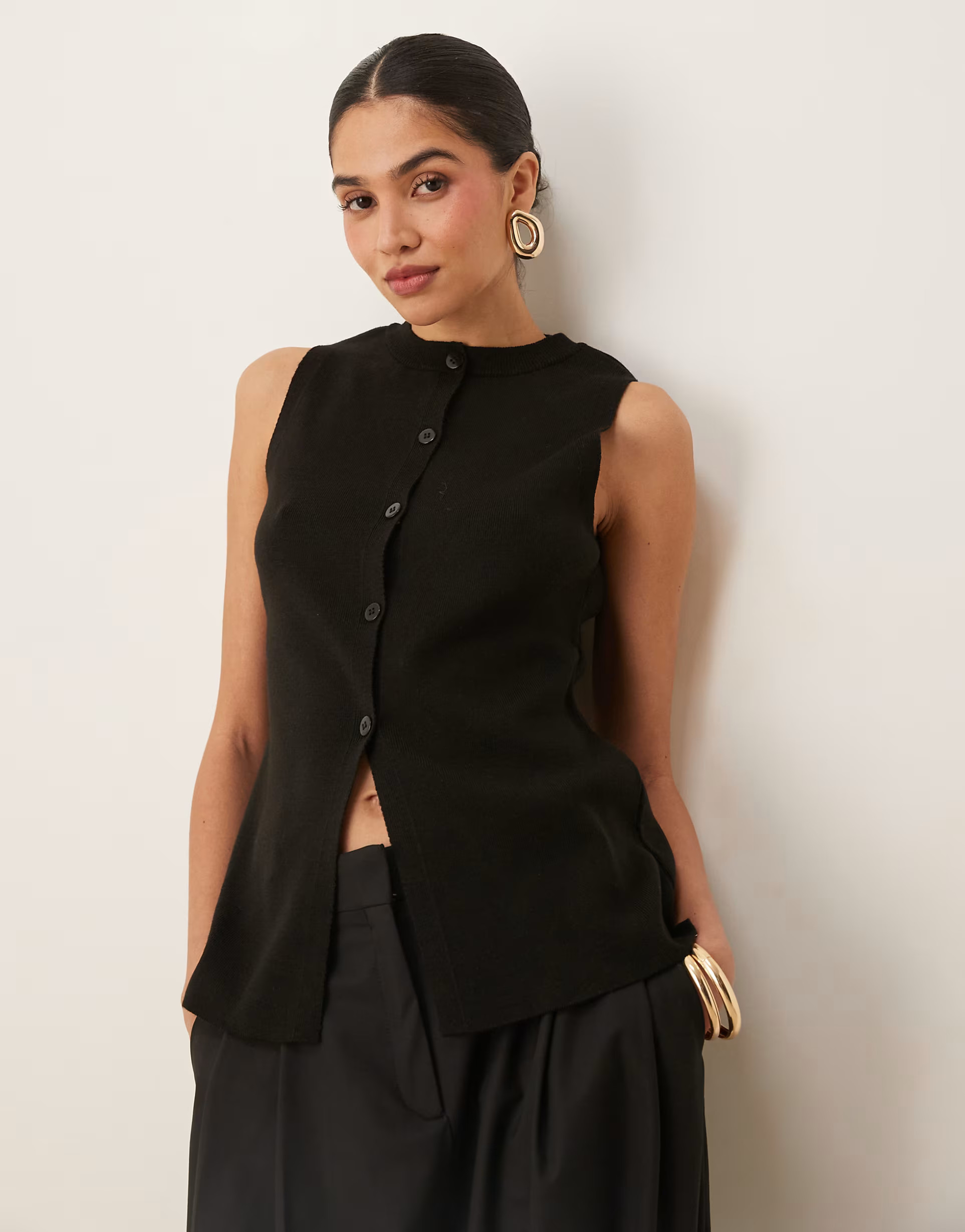 ASOS DESIGN knitted crew neck waistcoat with front split in black | ASOS (Global)