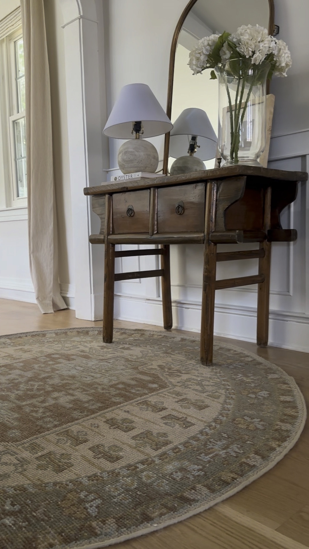 Find that finishing piece on a budget via the round ups on the blog ✨ This week’s affordable new arrivals and weekend sales are packed with a variety of items, plus, the start of Fall - shop via the link in bio!
•
Shop my entry and much more from the link in bio, too.
•
•
• 
hallway decor, entry decor, console decor, vintage console, table styling, home decor, simple home decor, neutral decor, arch mirror, spring summer florals, faux hydrangeas, lamp, round rug, loloi rug, affordable home decor, art print, burl wood frame, vintage art, woven rug, round rug #handknottedrug #woolrug


#LTKsalealert #LTKhome #LTKunder50