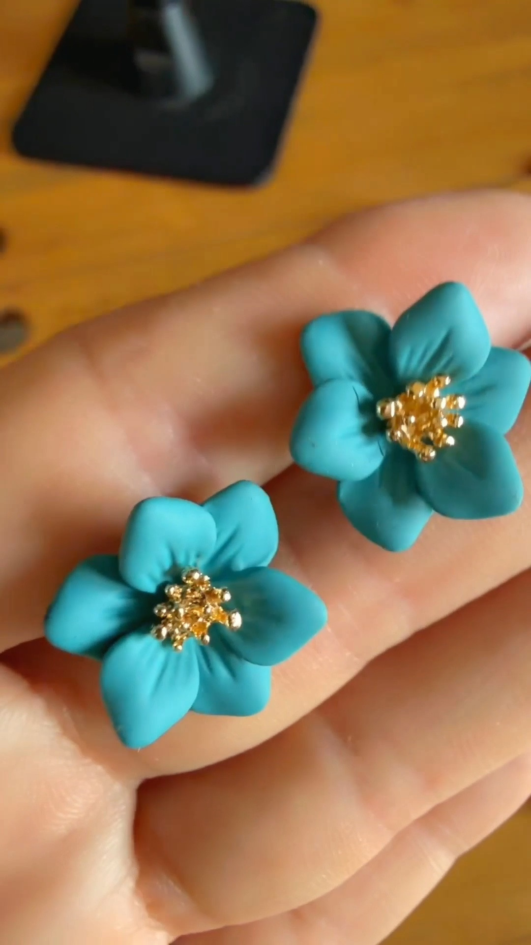 The perfect pop of color for your outfit! These gorgeous turquoise/teal floral stud earrings with gold accents are an absolute must-have for spring and summer. Super lightweight, vibrant, and effortlessly chic—whether you’re styling them for everyday casual wear, vacation outfits, or elevating a wedding guest look!

Pair with a white linen dress, neutral tote, and gold jewelry for a fresh vacation vibe.

Wear with a bold floral dress or pastel top to complement colorful summer looks.

Perfect affordable gift idea for birthdays, bridesmaids, or stocking stuffers!

turquoise earrings, teal flower studs, floral jewelry, matte teal studs, gold flower earrings, spring jewelry trends, summer accessories, vacation style, pop of color accessories, statement studs, lightweight earrings, beach vacation outfits, resort wear jewelry, affordable fashion finds, trend jewelry 2026, everyday studs, bridal shower outfit accessories, wedding guest jewelry.

#LTKstyletip #LTKunder50 #LTKunder25 #LTKfinds #flowerstuds #summerjewelry #vacationstyle #turquoiseearrings #floraljewelry #springfashion #accessories #statementearrings #goldaccent 

 #LTKSeasonal #LTKTravel
