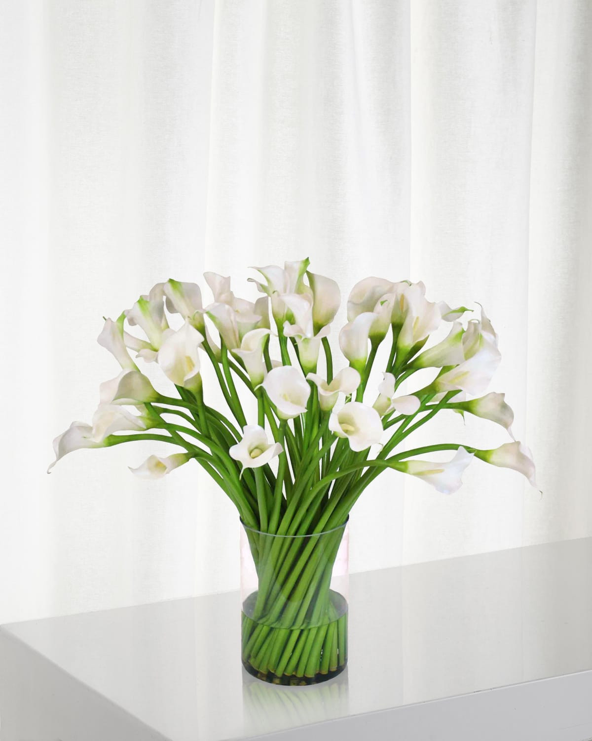 Calla Lily in Clear Cylinder Vase | Neiman Marcus