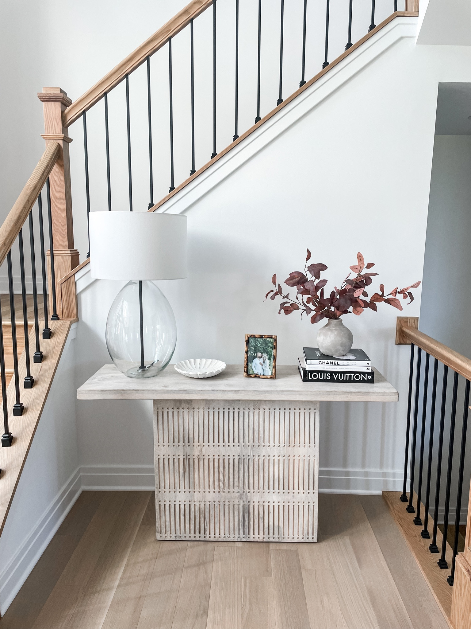 Console Tables can be hard to decorate. I added a vase on top of the decorated books, to give it more height and warmth! 

#ConsoleTable #ConsoleTableDecor #Foyer 

#LTKSale #LTKSeasonal #LTKhome