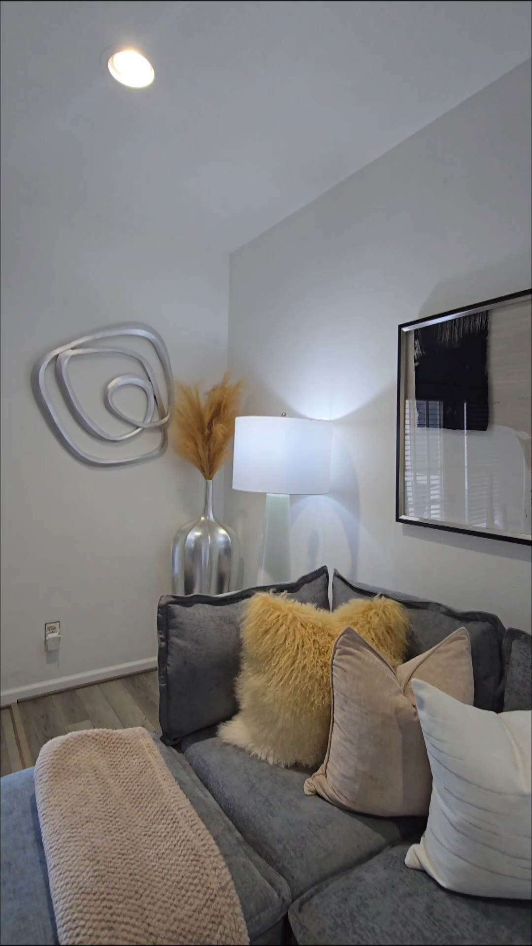 CREATE A COZY CORNER WITH A COUPLE OF PILLOWS AND A THROW 

