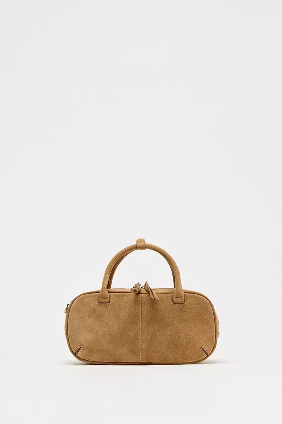 Mini bowling bag in suede. Top handle and removable crossbody strap. Topstitching detail. Interio... | Zara US