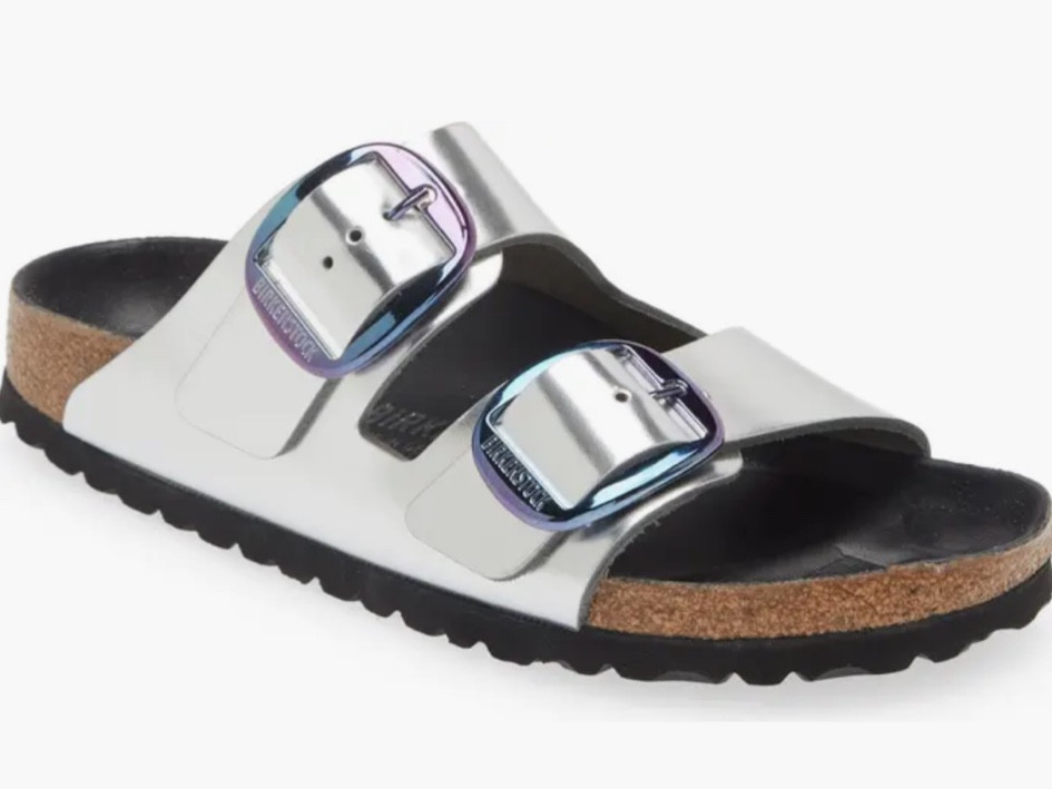 Birkenstock Arizona Big Buckle Slide Sandal  Oversized buckles cinch the standout look of a sandal that pairs glossy leather with the legendary Birkenstock footbed for time-tested comfort. Biometrically molded EVA cushioning absorbs shock and mimics the shape of a healthy foot, while pronounced medial and metatarsal arches support the instep and ball as you walk or stand.

#LTKstyletip #LTKshoecrush #LTKSeasonal