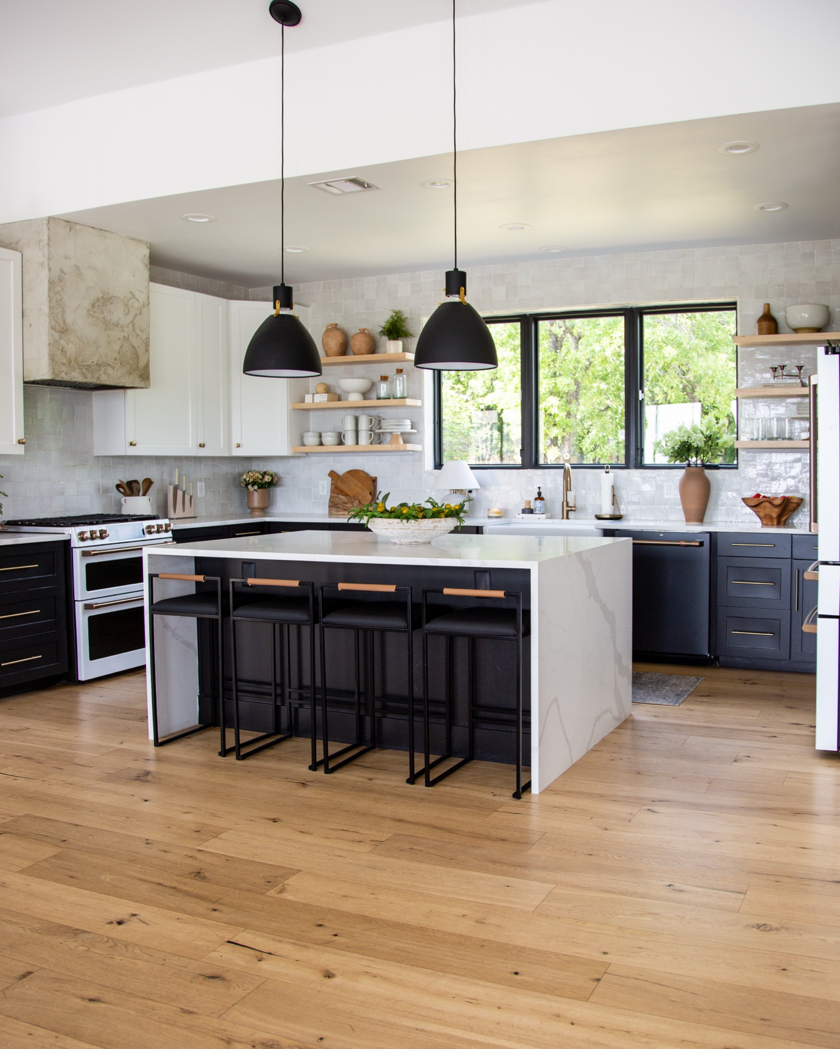 This kitchen is full of the little details that make it feel like home. The open shelving is styled with some of my favorite decor pieces, like the earthy vases, wooden cutting boards, and hand-thrown pottery that bring warmth and character to the space. I love mixing functional items like stacked plates and bowls with decorative touches like greenery and glassware for a balanced, lived-in look. The centerpiece on the island—a simple white bowl filled with fresh produce—adds a pop of life and color, while the woven basket and candle on the counter create a cozy and inviting feel. These small, thoughtful details are what make this kitchen more than just a place to cook—it’s the heart of our home.


#LTKHome #LTKFindsUnder100 #LTKSeasonal
