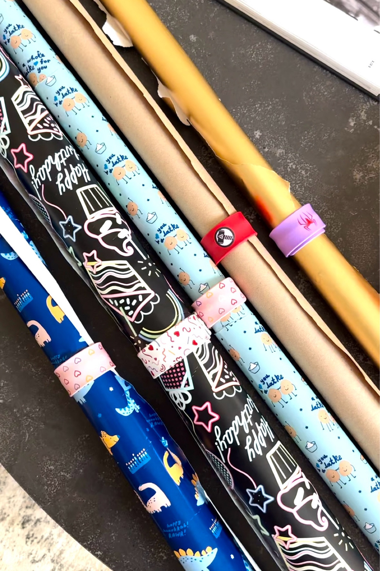 Wrapping paper storing is easy with these slap bracelets that almost every kid gets at some point from birthday parties. 

#LTKGiftGuide #LTKHoliday #LTKSeasonal