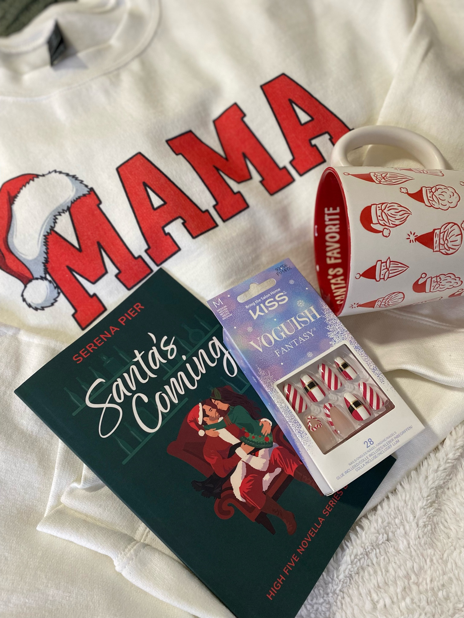 Holiday gift ideas for the Mamas in your life. This book is a super quick read that will get anyone in the Christmas spirit. It's a little spicy and a lot of fun. Pair it with this adorable Santa Mama shirt, Santa's Favorite mug and Santa nails. It's a whole vibe and I love it.

#LTKGiftGuide #LTKBeauty #LTKSeasonal