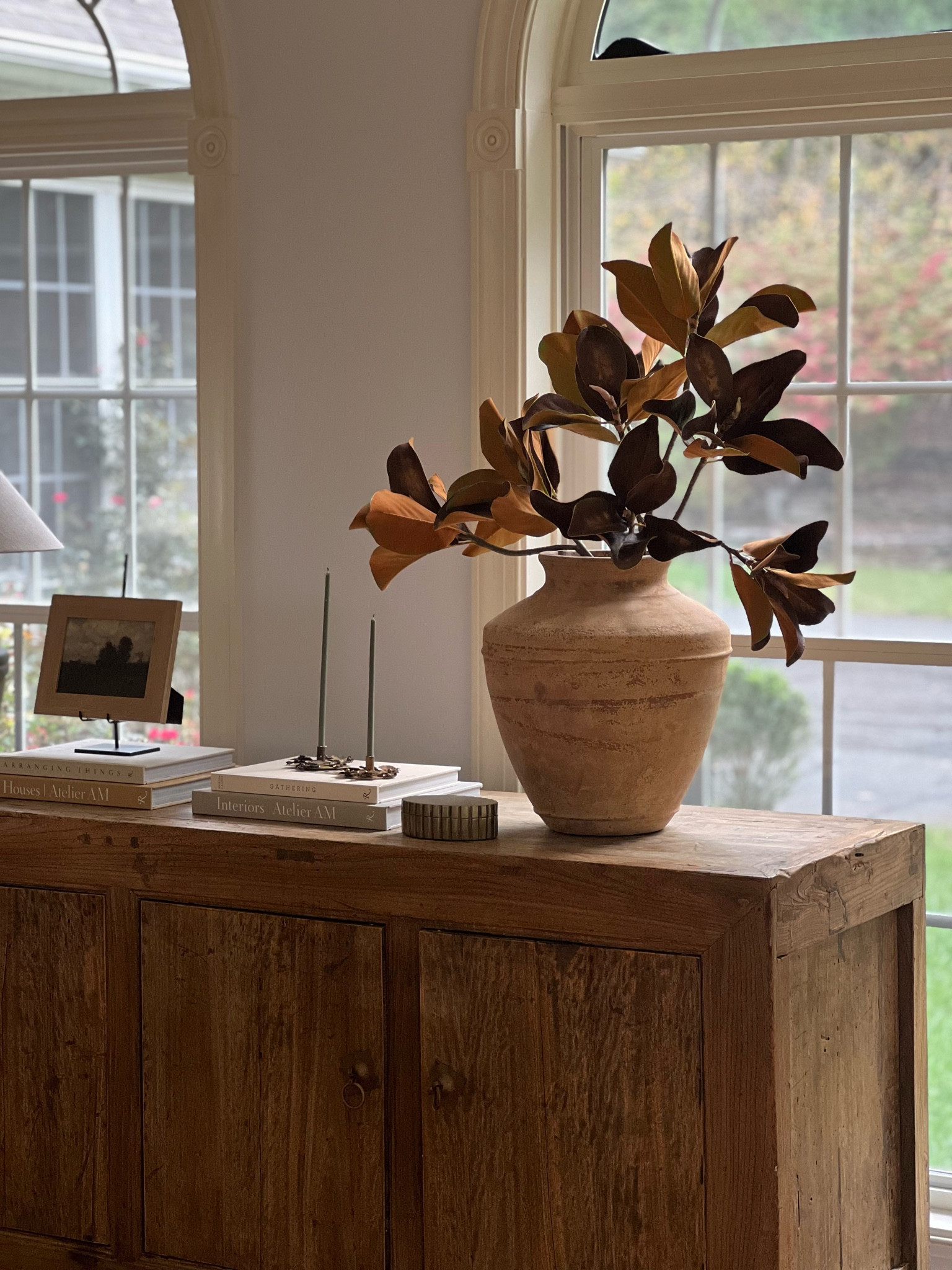 Elmwood console table styled for fall. Aged magnolia branches in an oversized olive jar.

Fall console table, Wayfair, Afloral, affordable home finds, terracotta vase, amber interiors vibe

#LTKHome #LTKSaleAlert #LTKSeasonal