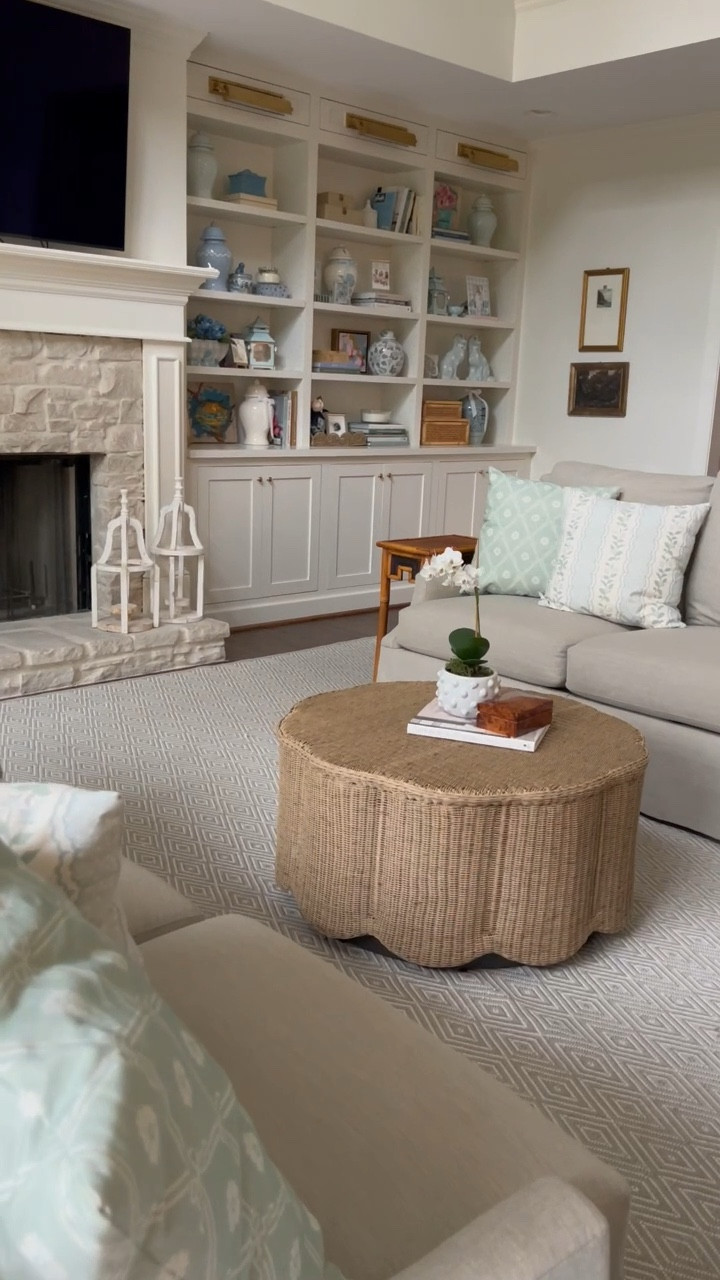 Before and after living room: new coffee table! I finally found the most perfect coffee table for my living room. It was so hard to find one at a reasonable price! This one is on sale right now! I love the wavy scalloped wicker style. And the round shape opens up more room for us to move around! This is way better than the giant rectangular one I had in here. The color is so much better too. Highly recommend this coffee table!

#LTKFamily #LTKVideo #LTKHome