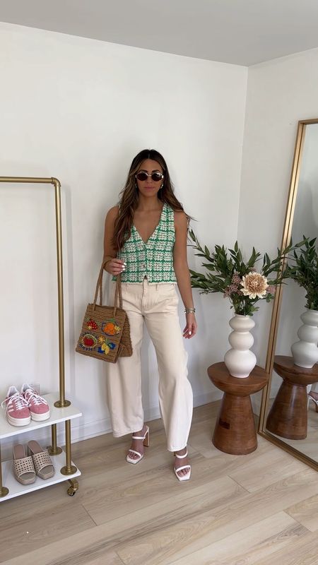 Elevated spring outfit idea — cream barrel jeans (26) paired with a green tweed vest (small) heels and a straw fruit print handbag 

Spring outfits | spring to summer transition outfits | work outfits 

#LTKstyletip #LTKfindsunder100 #LTKVideo