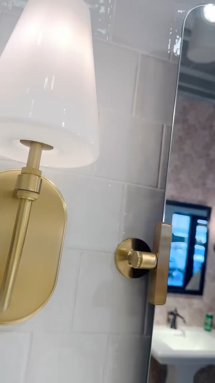 
Kohler’s Six-Day event starts now: Now through May 28, save 5% on orders more than $750, and 10% on orders of more than $1,500. Redeem with code SIXDAYS

We love the soothing and calm neutral tones in this master bath featuring a on-trend white oak double-sink bath vanity with a quarts countertop, a pair of round-edged mirrors,  modernized classical brass widespread bathroom sink faucets and elegant milk glass wall sconces. The soft curves, varies textures and muted tones make this master bath such a relaxing sanctuary to start  and unwind a day. The brass accents elevate the space with warmth and sophitication.



#LTKSeasonal #LTKSaleAlert #LTKHome