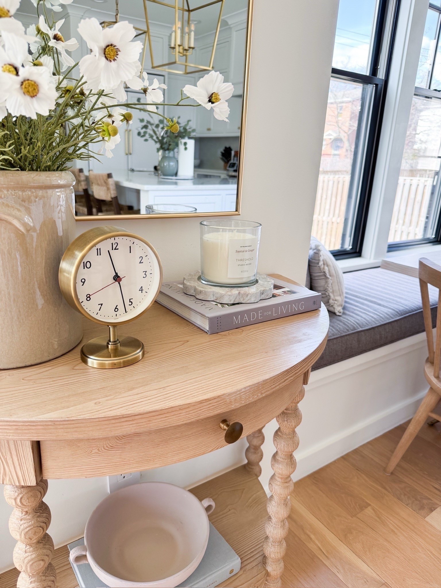 Breakfast nook with linear chandelier. Demilune light wood console table from Serena and Lillie. Look for less signs. Modern coastal, traditional home, home before, home decor styling. 

#LTKHome #LTKFindsUnder50 #LTKFindsUnder100