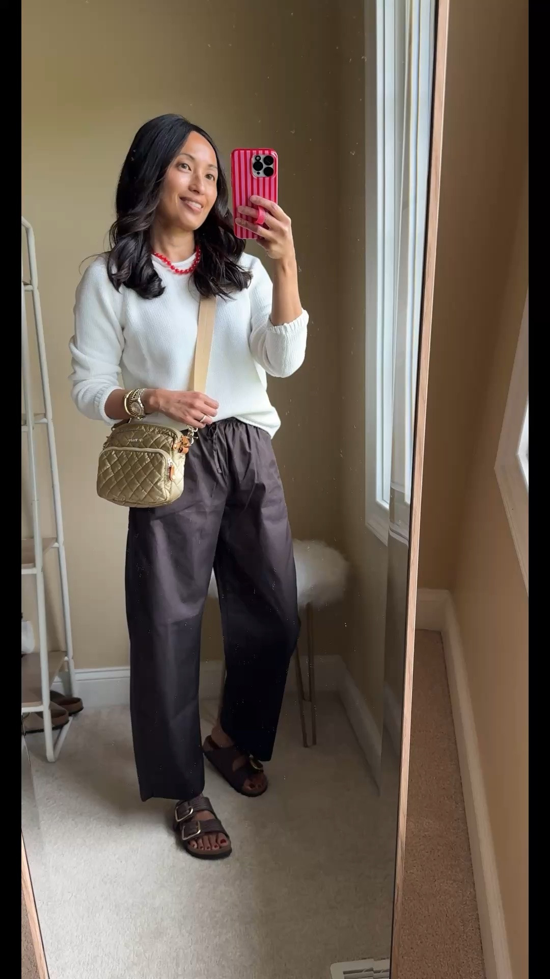 Modern classic spring outfit for a chilly day. 
- Cotton roll neck sweater. Can work year round. 
(Size up in exact sweater)
- Cotton poplin pants. Effortless pull on style for when you want a change from jeans. 
(I sized down in exact pants)
- Pop of color necklace 
- Textured slide sandals and nail polish from @Birkenstock US 
- Everyday crossbody bag that works well as a travel bag too
- Gold bracelets that elevate basic outfits
- Lip blush from @Merit for a comfy natural wash of color. My shade: vendome.

#LTKOver40 #LTKootd