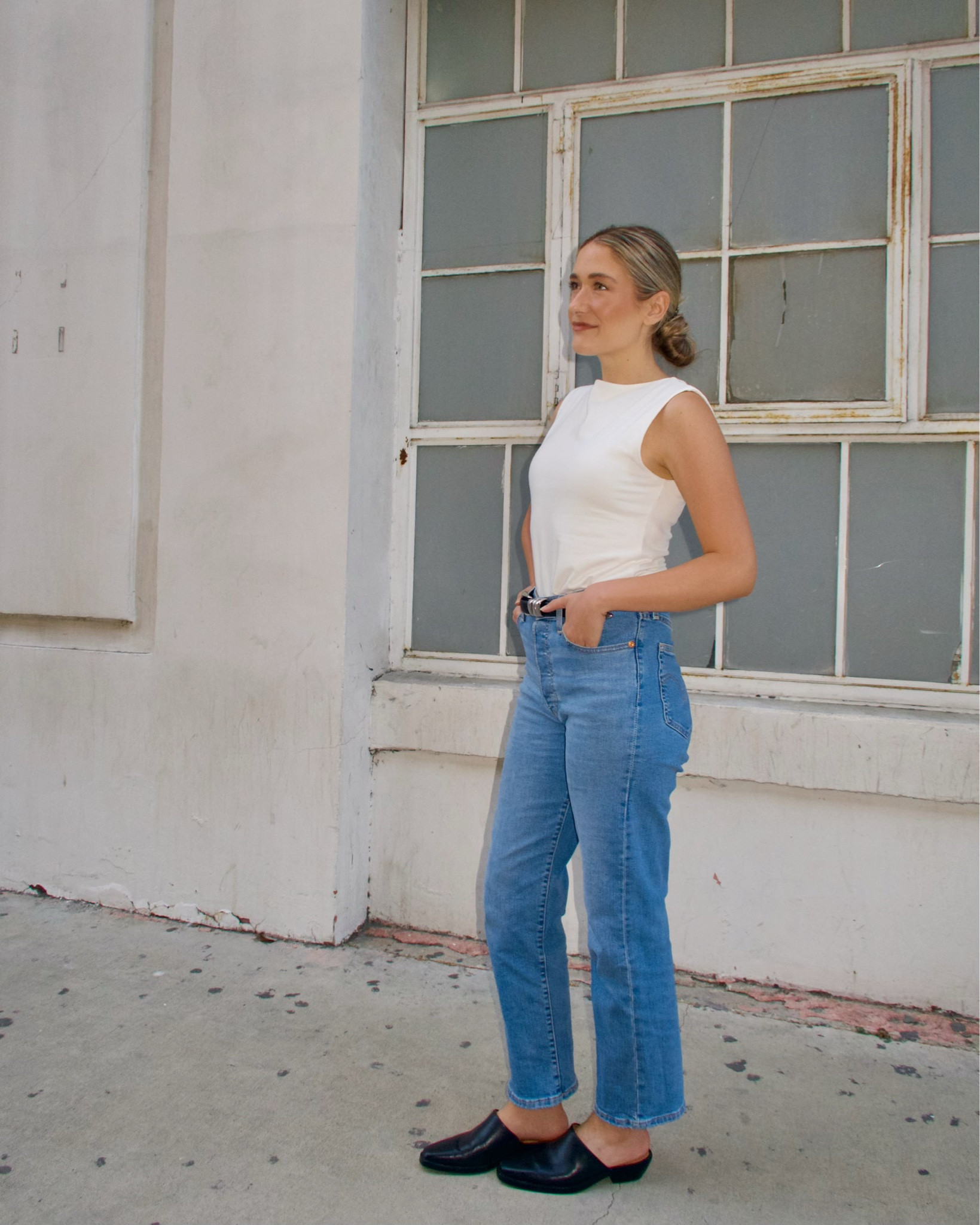 A classic white top and jeans look