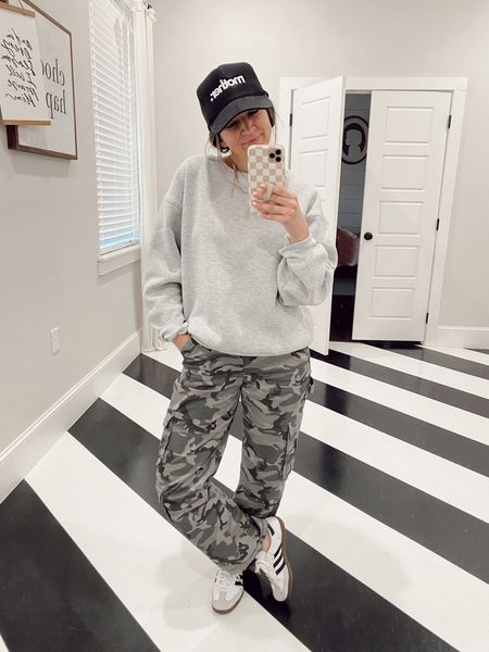 -Camo cargo pants (true to size; wearing short length) 
-gray sweatshirt (sized up to a medium) 
-sambas (run big; size down half size)

#LTKsalealert #LTKstyletip #LTKSeasonal