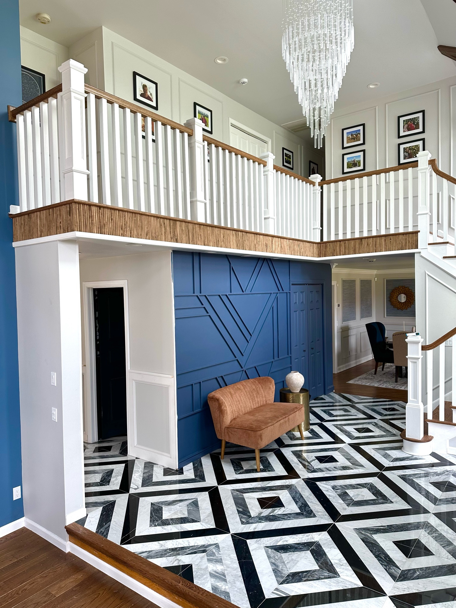 Updated the foyer with some wooden dowels to add that fluted look. The wooden dowels add more warmth and color to the foyer design.

#LTKstyletip #LTKhome