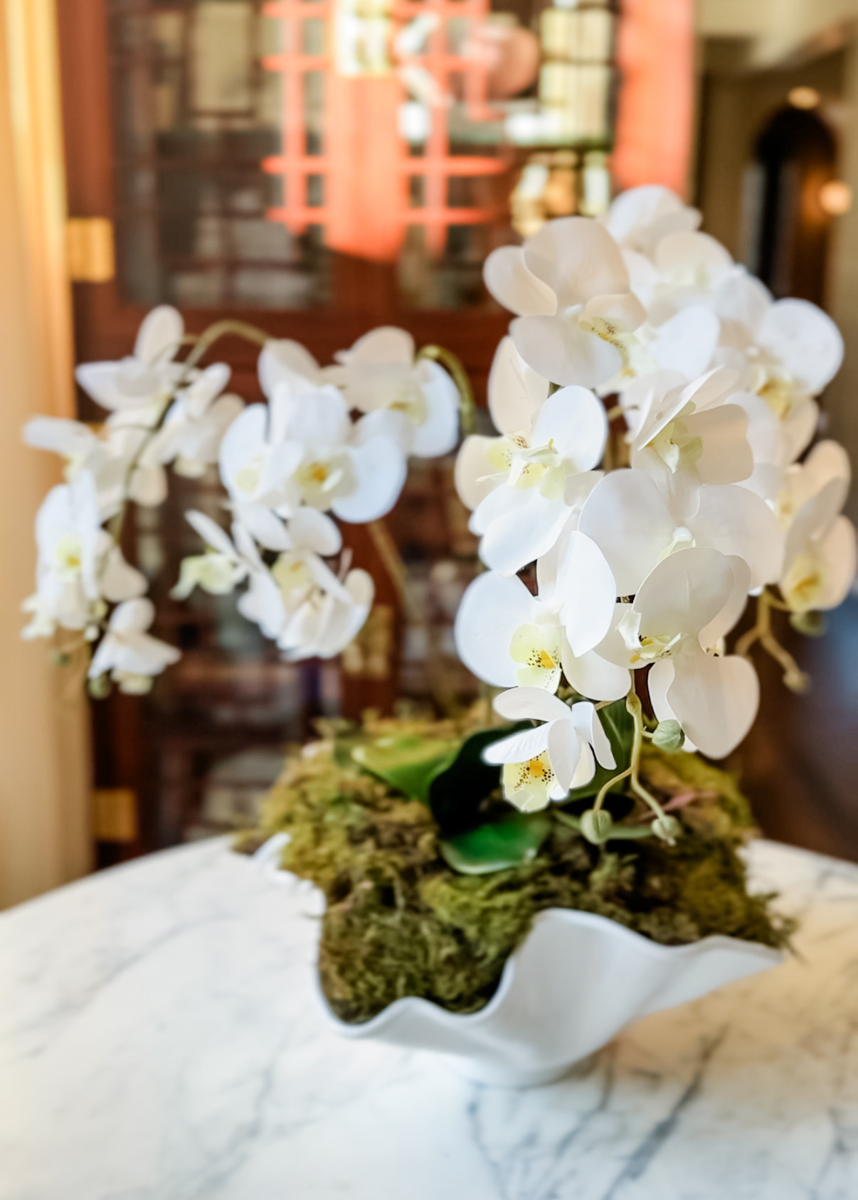 Love these faux orchids for a great spring DIY. Such an easy way to create a beautiful center piece for less, and without trying to keep anything alive. Such a great addition that looks great all year round. 

 