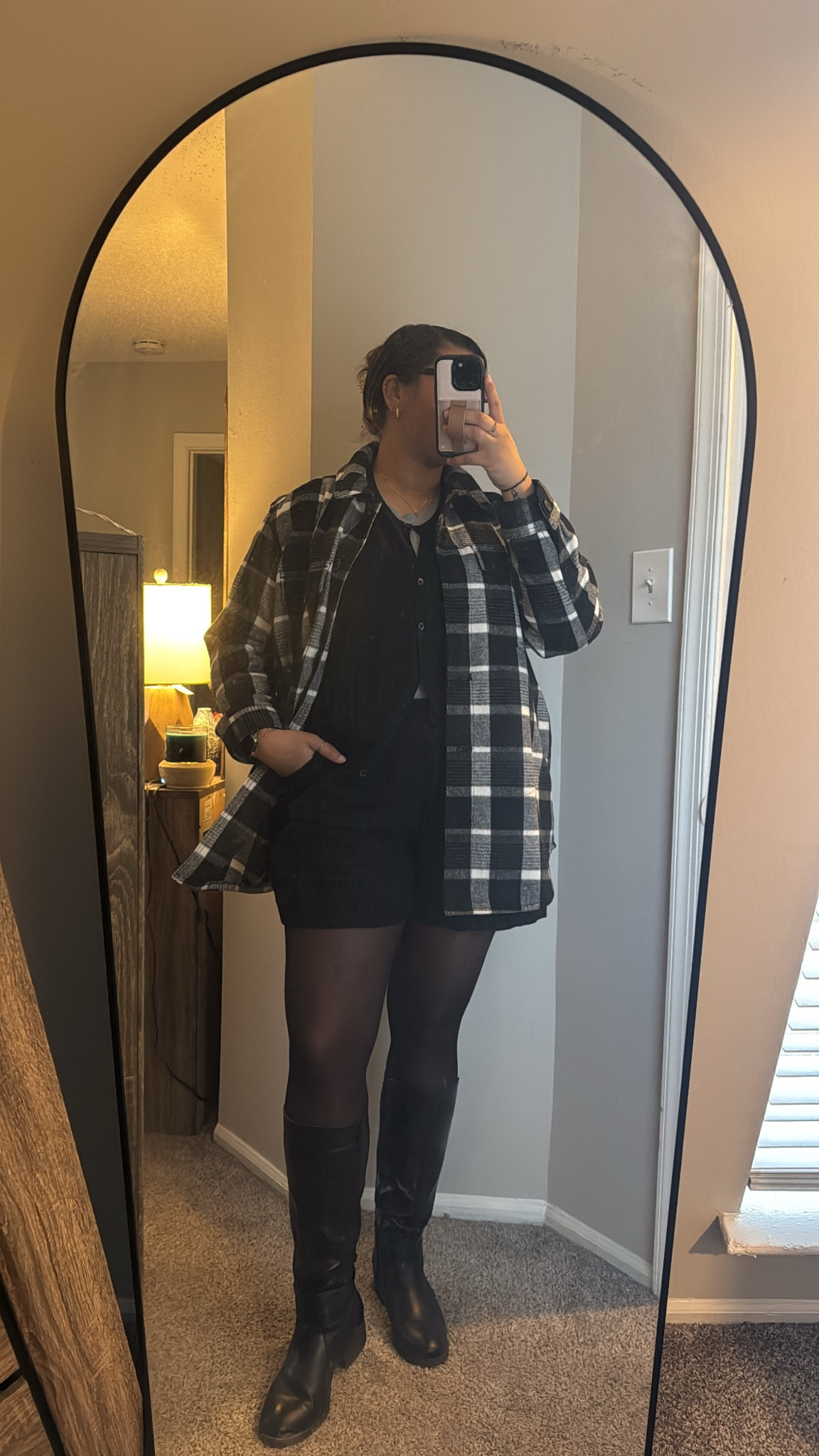 Winter layering done right! 🍂✨ Keeping it cozy and chic with this effortless outfit: black shorts paired with classic tights, a comfy grey tee, and my favorite button-up sweater. Topped it all off with a flannel shacket (an oldie but a goodie!) for those crisp winter days. Finished the look with sleek black boots for the perfect touch.

I’ve linked similar pieces to help you recreate this versatile look—perfect for coffee runs, casual days at work, or weekend errands. Tap to shop!

#LTKWinterStyle #OOTDInspo #LTKFinds 

#LTKWorkwear #LTKTravel #LTKStyleTip
