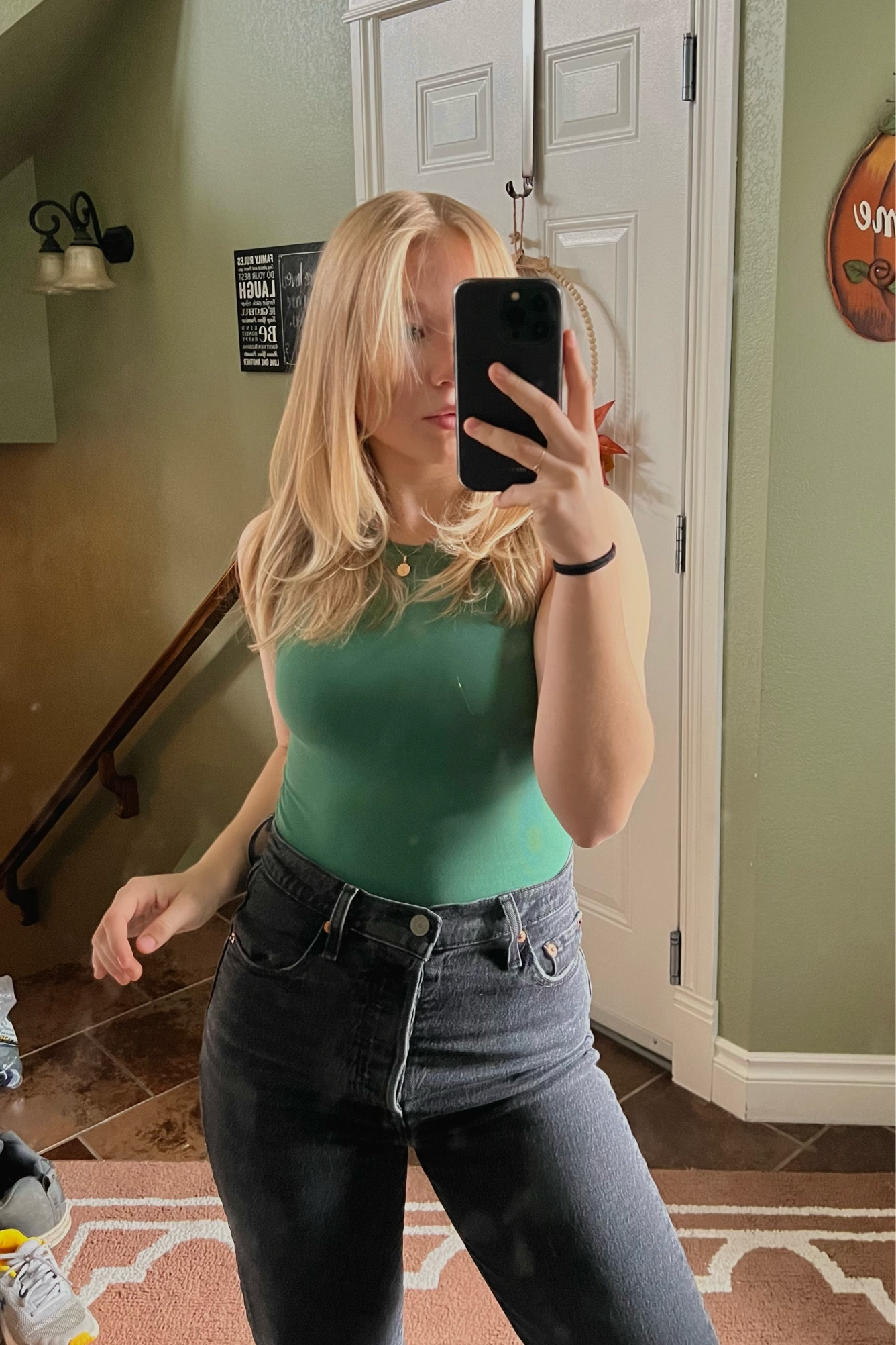 forest green bodysuit with grey straight legged levi’s jeans

#LTKworkwear #LTKstyletip #LTKSeasonal