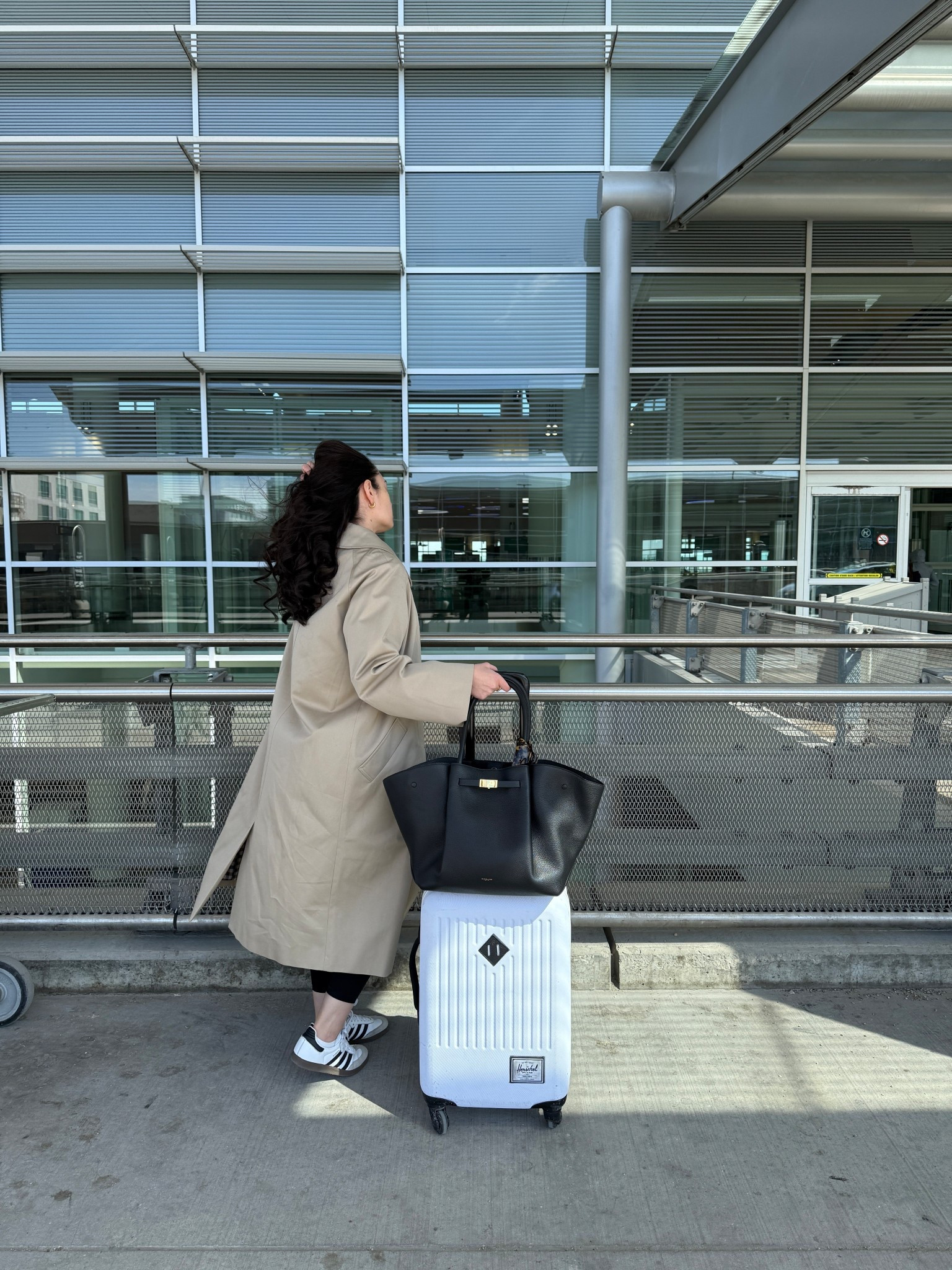 Trench: Sezane
Leggings: Old Navy
Sneakers: Adidas
Bag: Demellier London
Suitcase: Herschel Supply Co

#LTKtravel