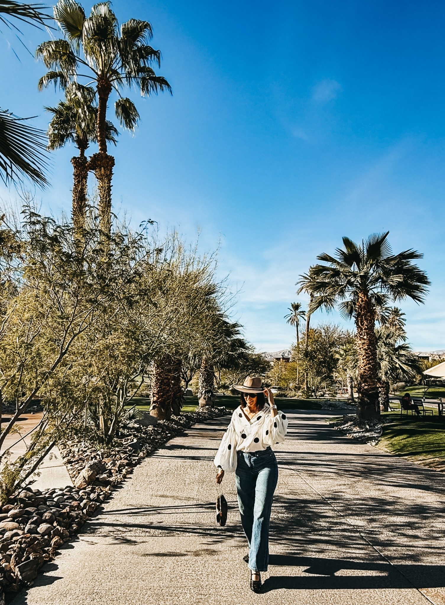 Winter to spring outfit idea! 🖤🤍This floaty polkadot top is so pretty and the perfect transitional top! ￼

- top - size small
- wide leg jeans - size 4 

#LTKOver40 #LTKootd