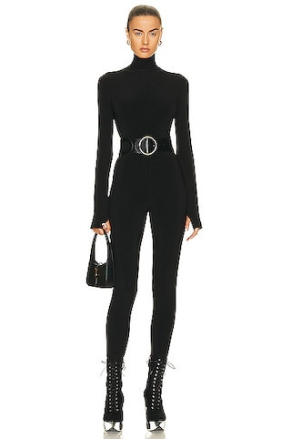 Norma Kamali Long Sleeve Turtleneck Catsuit with Footie in Black | FWRD 