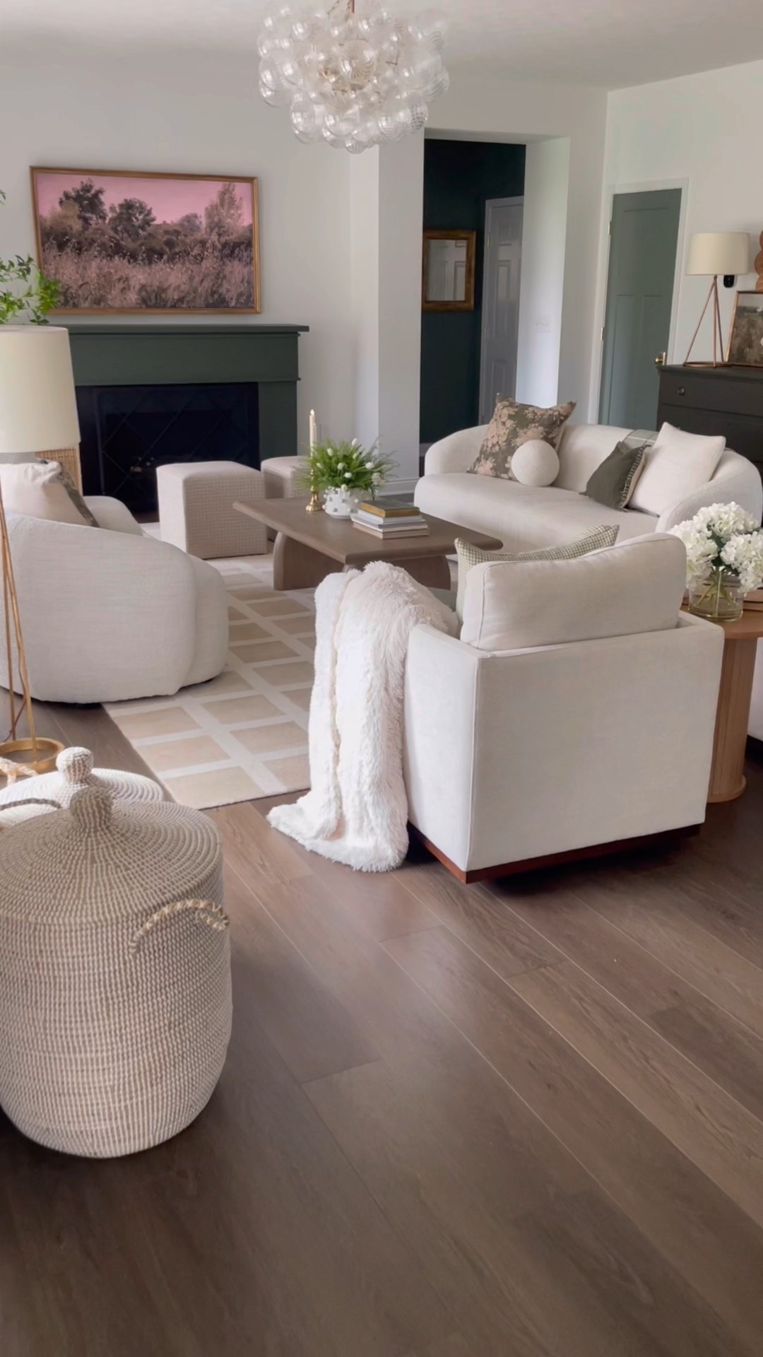 Loving this gorgeous new light fixture from @wayfair that we just added to our living room. We’ve got over 15 more great #wayfair finds in this video - from the green pouf ottomans, to the coffee table and the beautiful scalloped mirror! #ad 

#LTKHome #LTKSeasonal #LTKSaleAlert