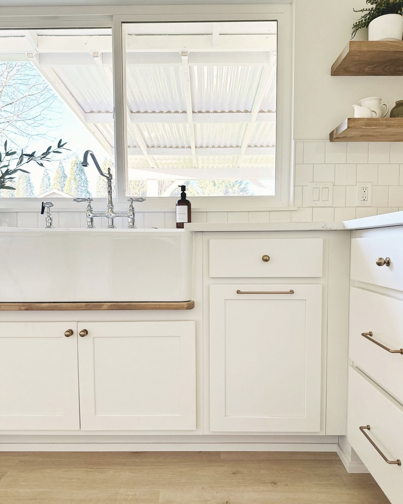 All the flip house kitchen details!

+ Cabinets are Express Jamestown partial overlay in white.
+ Countertops are local from Jy granite and the color is Alaska Bianca quartz
+ Custom drip rail and shelves stained in Aged Walnut by Varathane with a coat of Minwax Simply White on top. Always wipe on and off fast.
+ Floors are discontinued but we highly recommend Pergo flooring for all of our projects!

Kitchen remodel, white kitchen, kitchen inspiration, kitchen design, kitchen ideas, coastal kitchen, modern kitchen, design inspiration, kitchen hardware

#LTKStyleTip #LTKHome