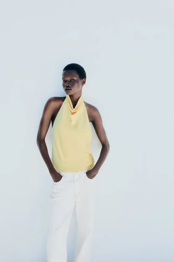 Halter neck top with an open back. Back closure with hidden buttons. | Zara US