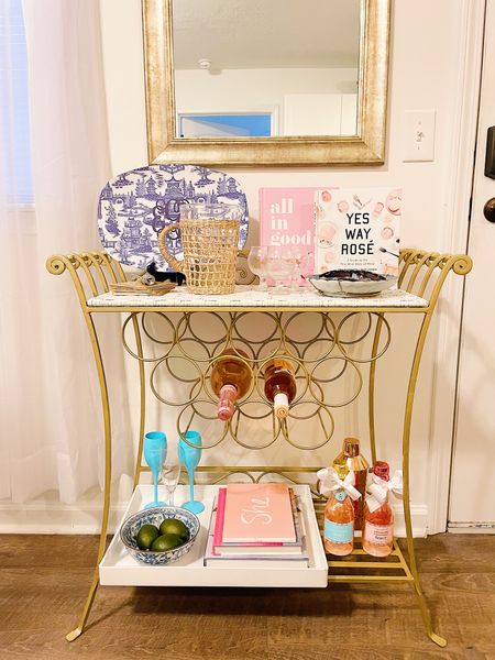 How I’ve styled my bar cart!! Featuring pink coffee table books, rattan textures, blue and white china, fun colored wine glasses, and sugarfina champagne bear bottles!! Linking exact and similar pieces below that I love!! From Amazon, Etsy, and Nordstrom! 