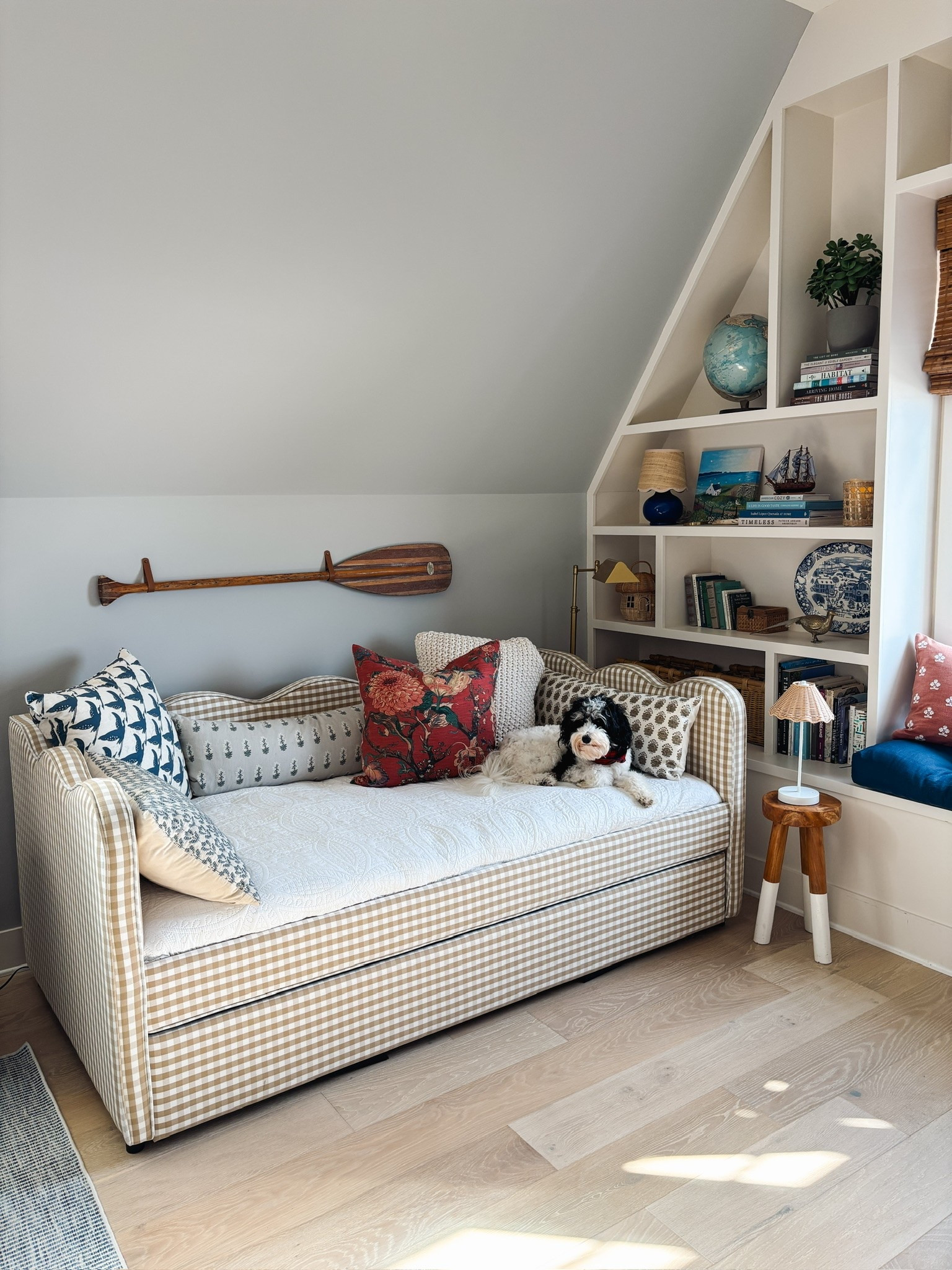 Scalloped gingham daybed with trundle, wood stool with cordless lamp