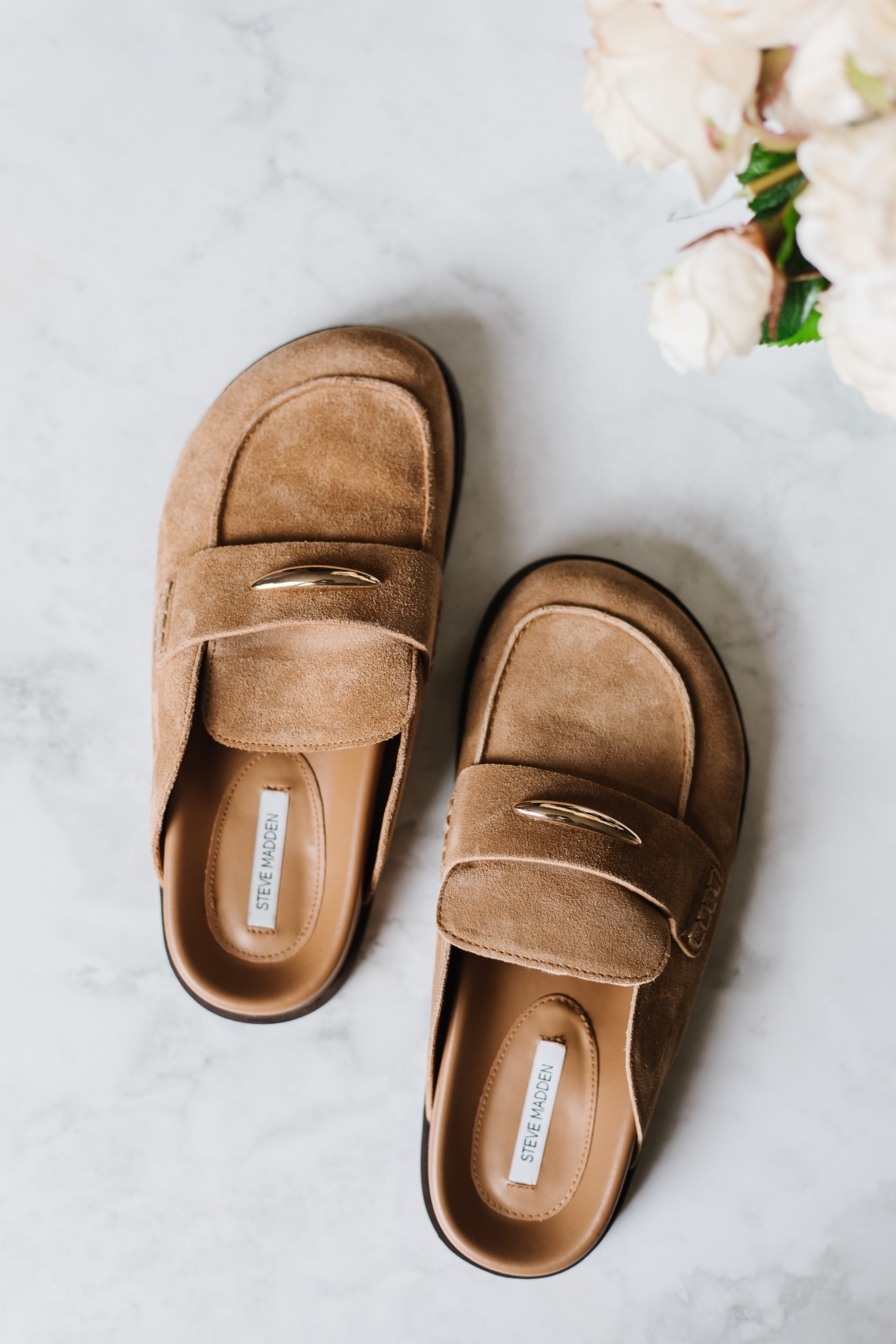 These Steve Madden slides are the perfect elevated, simple shoe you can just throw on with denim. The suede look and gold detail give them a polished feel while still being super easy to wear. I also think these transition really well into spring — especially styled with lighter denim, trousers, or even casual dresses. #Ad @Steve Madden US 

neutral slides // suede loafers // elevated casual shoes // denim outfit staple // easy everyday style // spring transition shoes // classic neutral footwear // effortless outfit piece