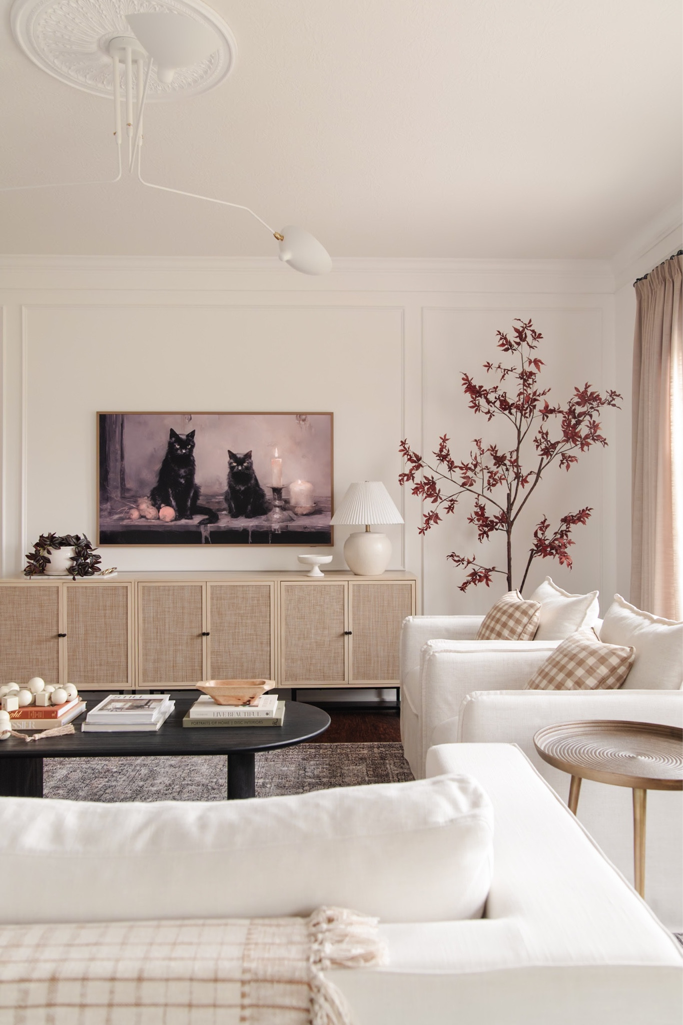 Rattan media console, cane cabinets, rattan sideboard, berea chair, black coffee table, gingham pillow

#LTKhome #LTKHalloween #LTKSeasonal