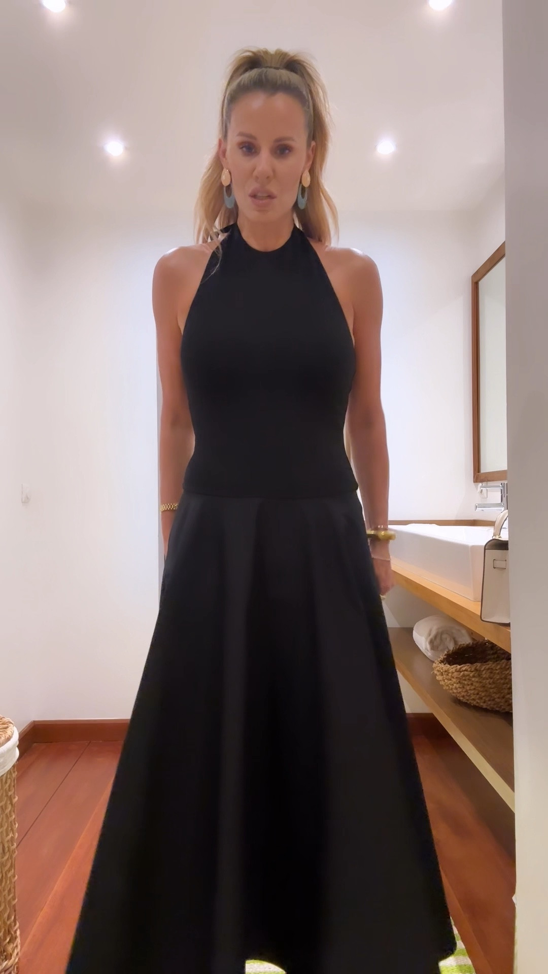 St Barths Dinner // This halter dress is so incredibly flattering! The drop waist fit & flare style totally lengthens any body! I wore with platforms but sandals would look so chic too. Since the halter tie doesn’t allow for a necklace, I paired it with some statement earrings! I am wearing a small and nipple covers….no bra needed but a strapless one would work. Also, this mini Kelly look a like comes in tons of colors and is $38! // Resort Wear, Vacation Outfit

#LTKstyletip #LTKover40 #LTKtravel