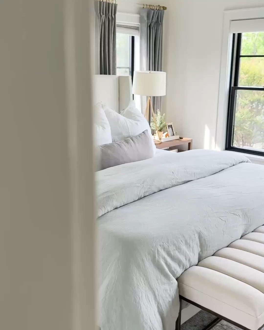 This bedroom is a collection of my most-loved pieces. The Wayfair Tilly upholstered bed in Zuma White, blue-gray linen bedding, organic cotton blanket, Amazon linen Euro shams, brass lighting, whitewashed Pottery Barn dresser, and oversized coastal artwork all work together to create a calm, timeless retreat.

And I can’t forget the rug—it’s my favorite in our home. The muted vintage-inspired pattern with layers of soft blue-gray, beige, and ivory adds depth and character while still feeling incredibly serene. It’s one of those pieces that truly makes the room.

#LTKstorytime