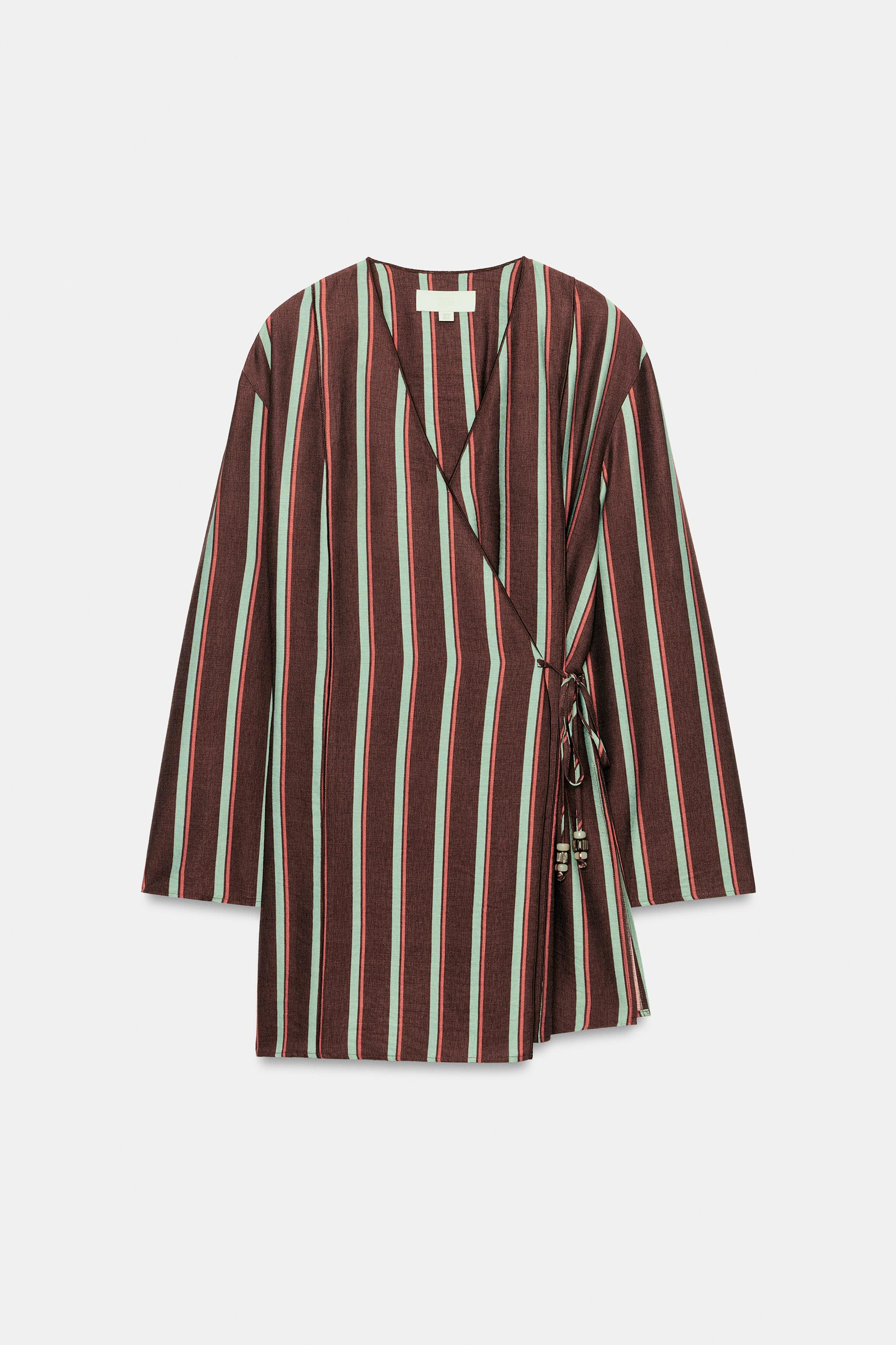 Long-sleeved jacket featuring a hem with side vents. Front wrap fastening with beaded ties. | Zara UK