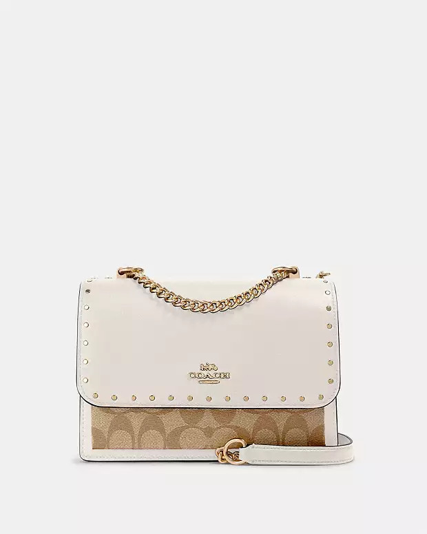 Klare Crossbody Bag In Signature Canvas With Rivets | Coach Outlet US