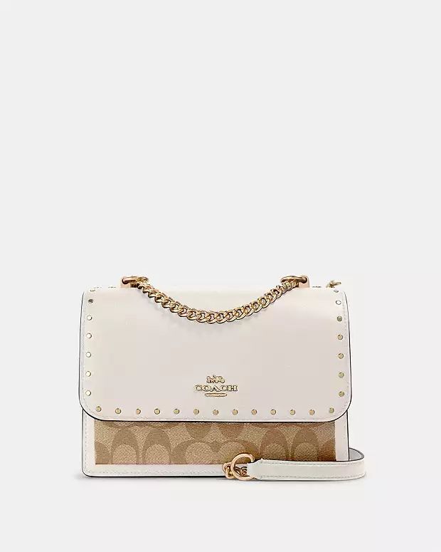 Klare Crossbody Bag In Signature Canvas With Rivets | Coach Outlet