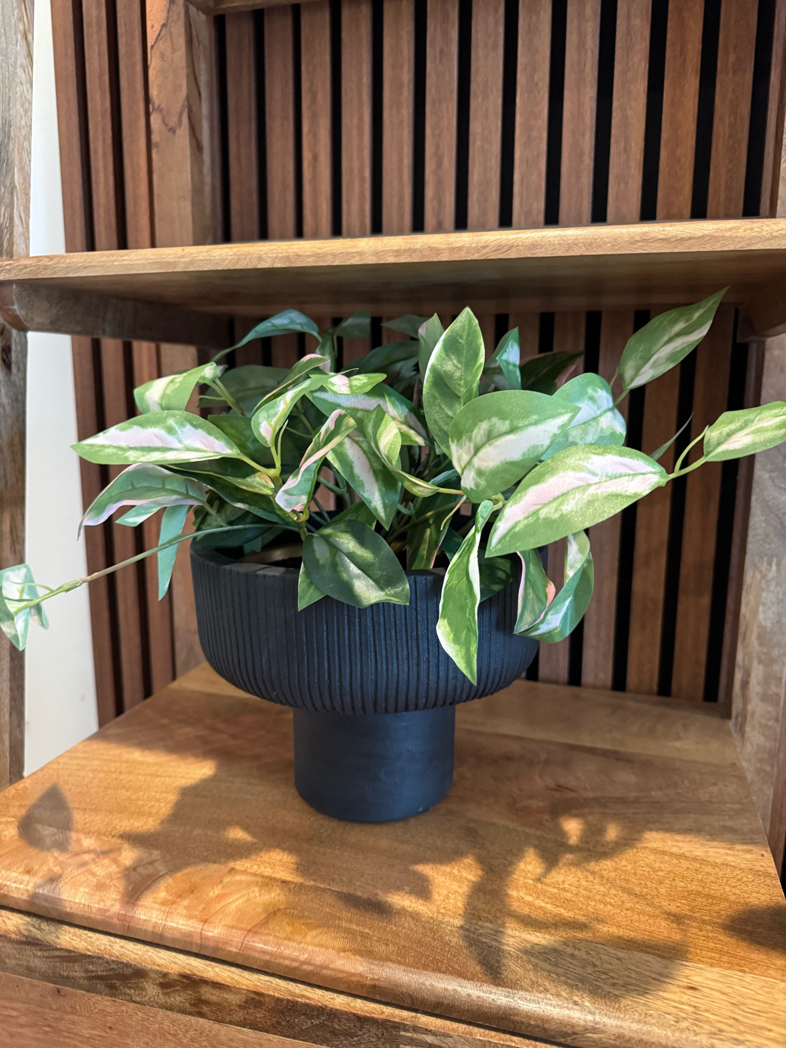 Faux leaf plant and planter from Target.  The plant sits inside the planter perfectly 

#LTKFindsUnder50 #LTKHome #LTKStyleTip