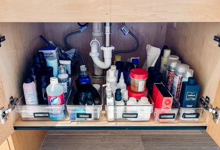 Under sink storage is not the most glamorous of spaces, but it has the ability to be one of the most useful! As with most spaces - creating clear categories is key, and also being mindful that we are typically looking top down when getting under the sink so ease of use is critical.