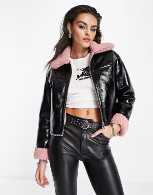 Bershka faux shearling detail cropped jacket in black vinyl with pink trim | ASOS (Global)