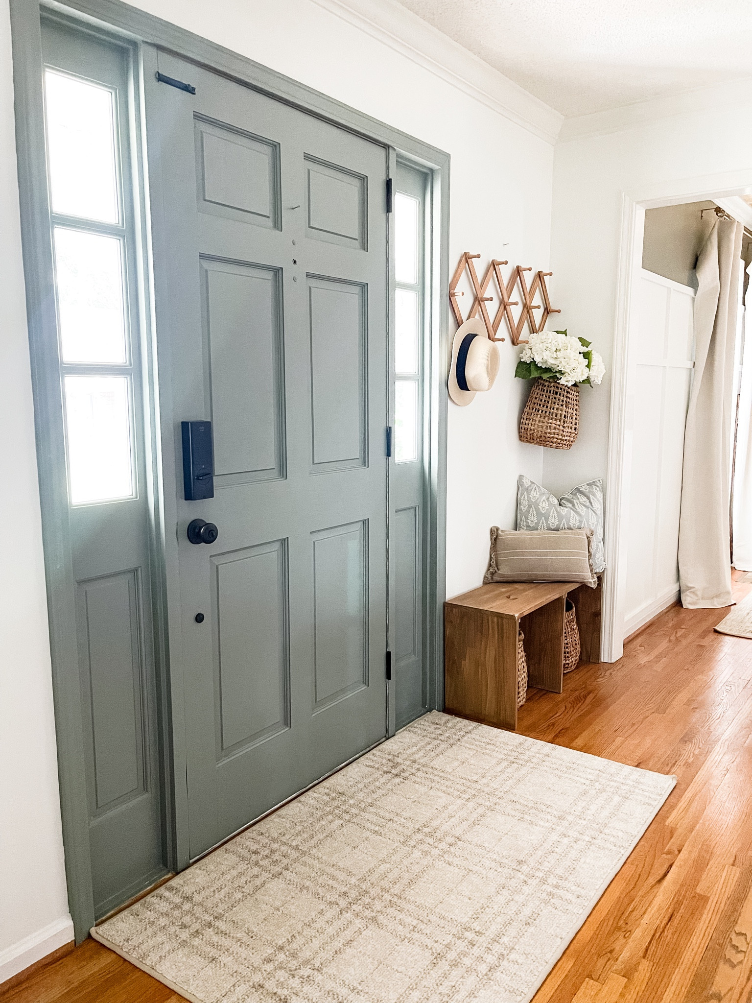 Summer entryway views 

*Bench is a DIY.
•Front door color: PPG paints Gray Heron 
•walls: BM Chantilly Lace 

#LTKstyletip #LTKhome #LTKSeasonal