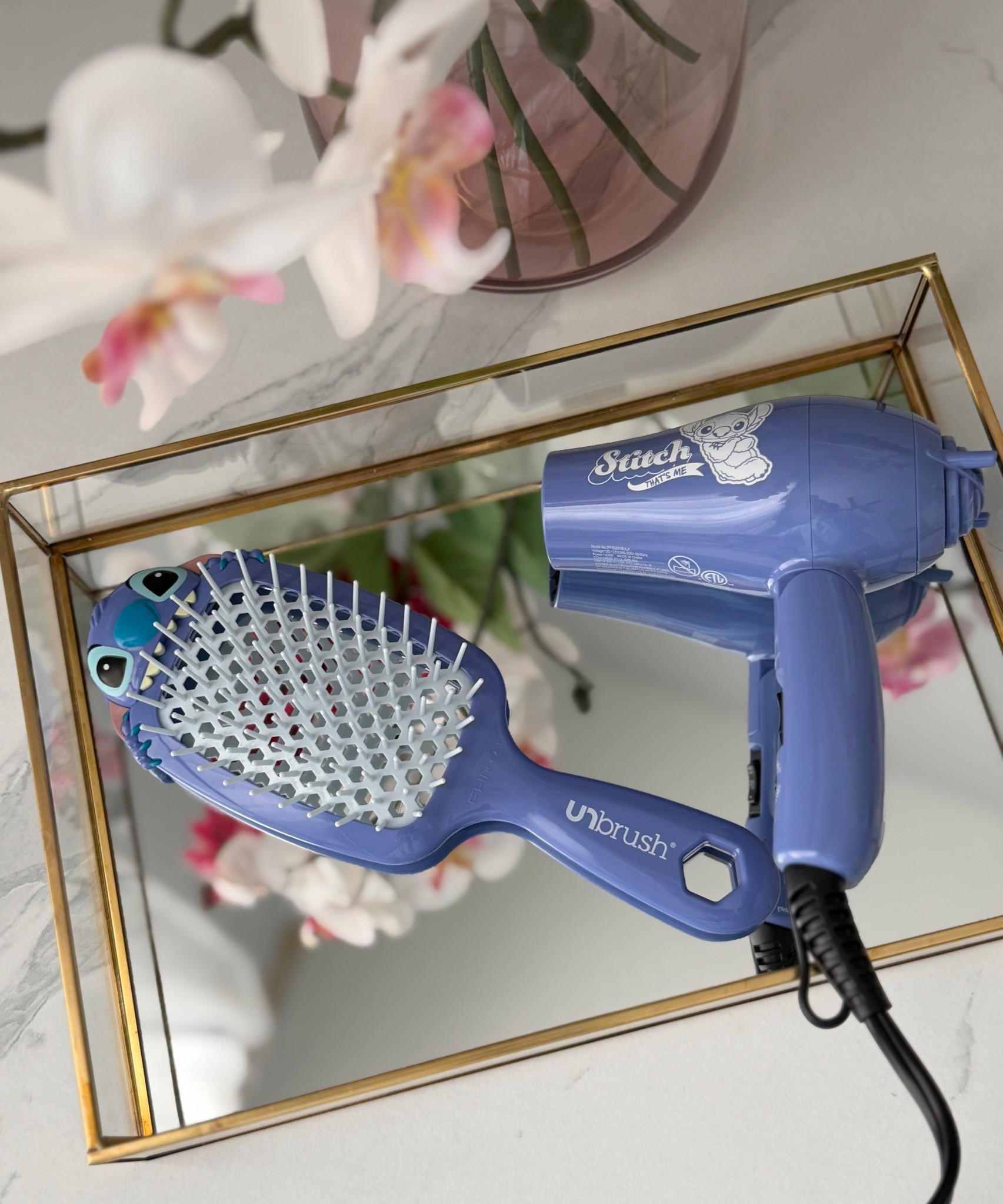 Disney Vacation must have essentials! Travel sized mini hair dryer and UNbrusg detangling brush. Lilo and Stitch 

#LTKBeauty #LTKgrwm #LTKmorningroutine