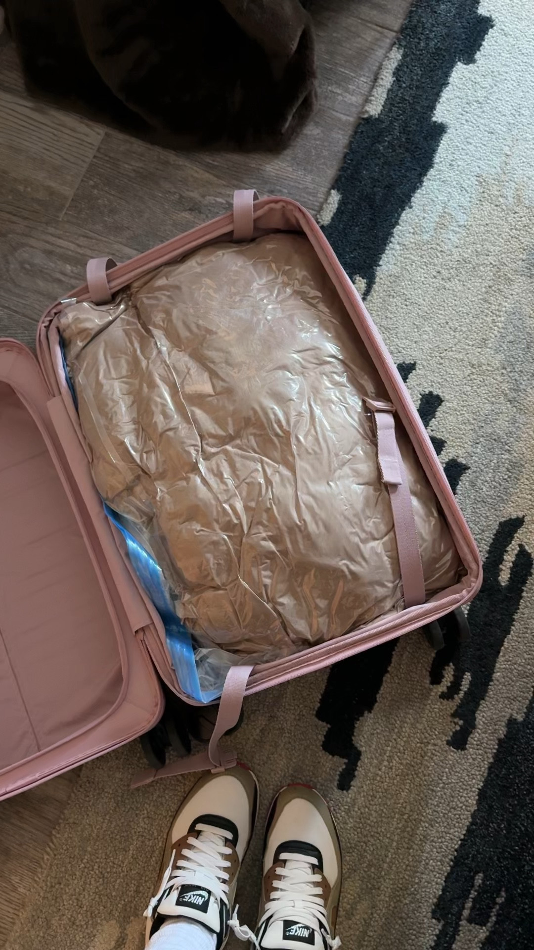 Two ski suits, a fur coat and a leather puffer all on one side of a carry on.  Yes please this is the best travel hack. 

 