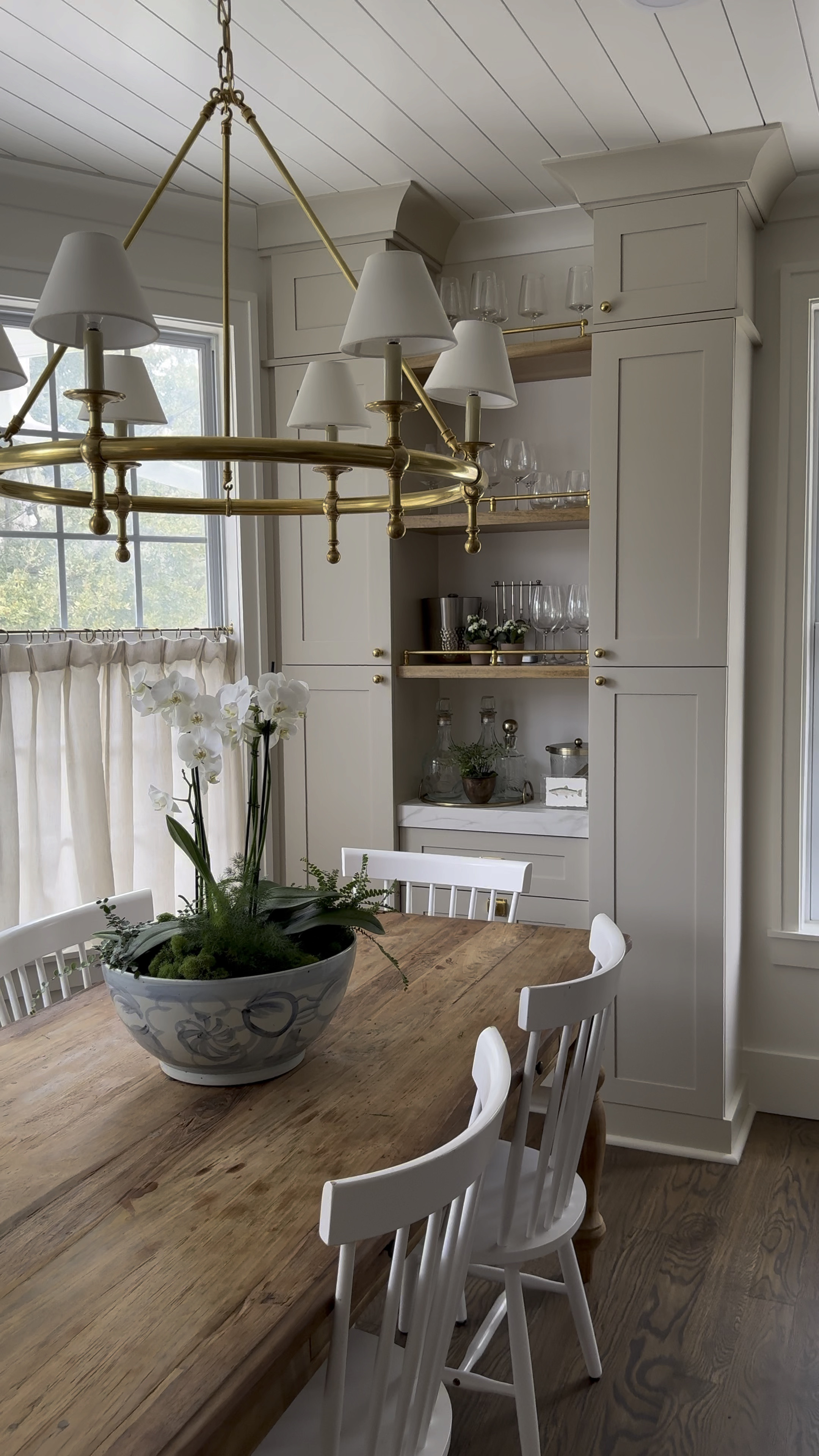 Designing our bar area that serves as a dining nook with Amazon curtains, unlacquered brass railing, and etched glassware. Table is local but I added similar to get the look. 

#LTKhome #LTKsalealert #LTKSeasonal