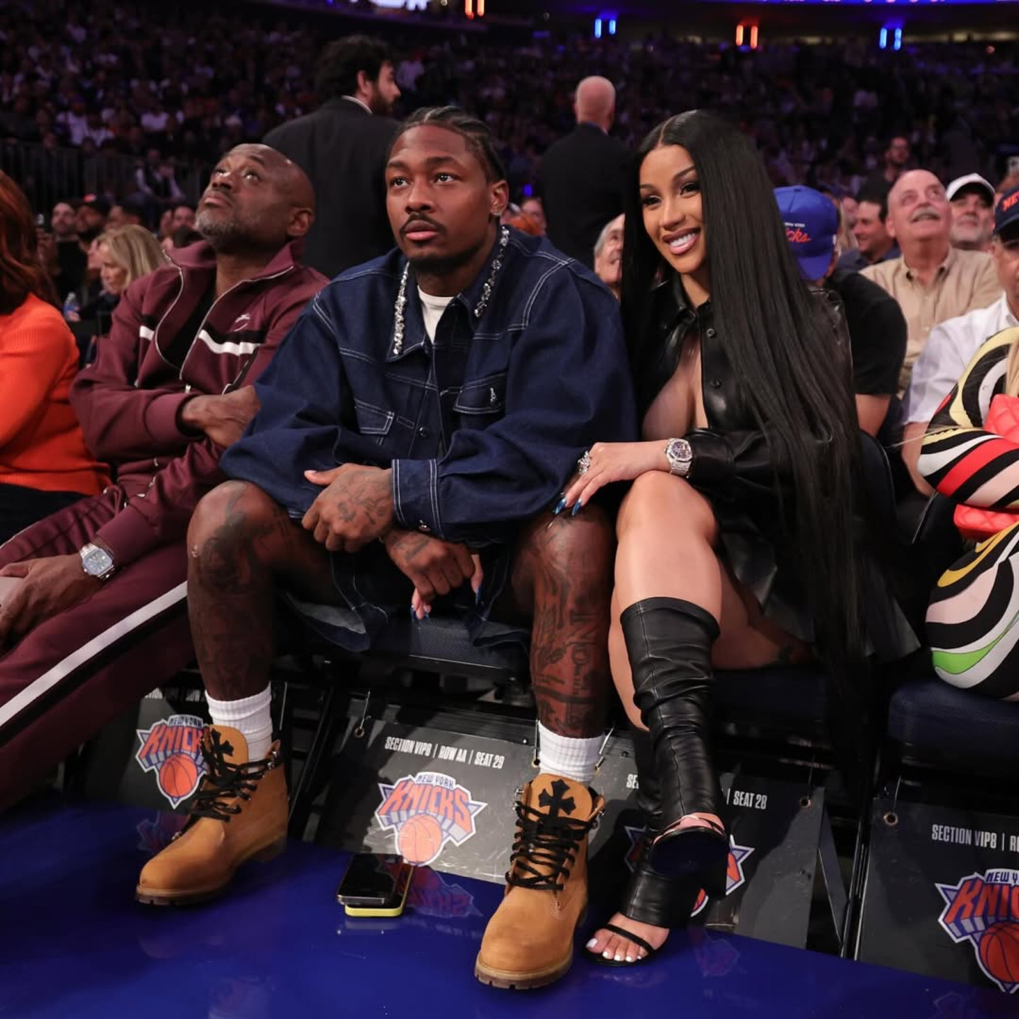 @iamcardib and #stefondiggs posed outside at a basketball game, with #cardib in a @miumiu top and skirt and $1,389 @courreges OBLIQUE WEDGED LEATHER OPEN TOE BOOTS . Stefon matched her fly in a $1,135 @simonerocha_ blue embellished denim jacket. Hot! Or Hmm..? To this #fashionbombcouple ? Shop their looks at the link in bio💣
📸 Getty #cardibfbd #stefonsiggsfbd 